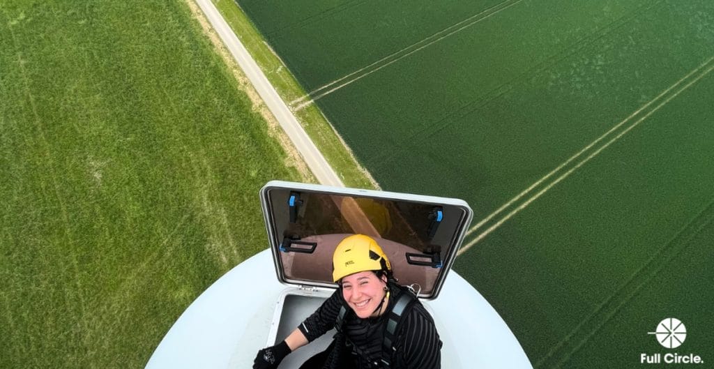 woman climbing wind turbine